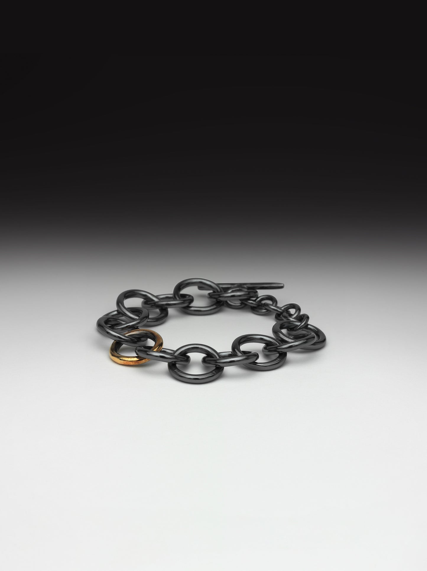 Oxidised chunky silver bracelet with gold link